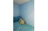Don't be afraid to swathe your bedroom in a saturated color like turquoise.
