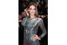 Victoria's Secret model Alessandra Ambrosio paired a matte silver ring and statement earrings with her metallic gray dress.